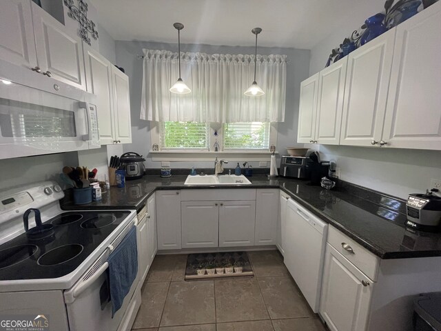 1103 E 2nd Ave SE, Rome, GA 30161 - kitchen with white appliances, a sink, white cabinetry, and decorative light fixtures