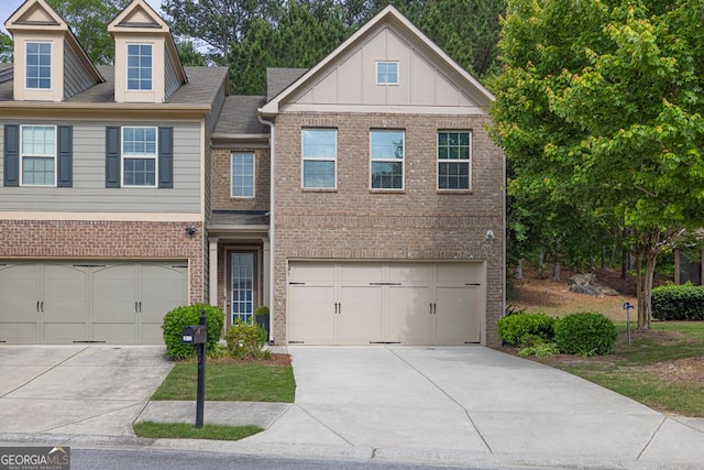 3982 Brockenhurst Dr, Buford, GA 30519 - view of front of home with concrete driveway, an attached garage, and brick siding
