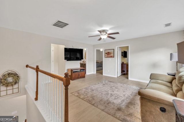 3982 Brockenhurst Dr, Buford, GA 30519 - living room featuring a ceiling fan, wood finished floors, and baseboards