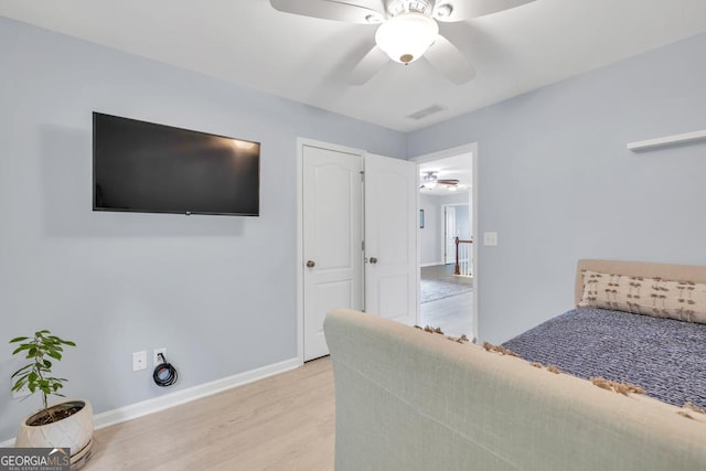 3982 Brockenhurst Dr, Buford, GA 30519 - bedroom with light wood-type flooring, baseboards, and ceiling fan