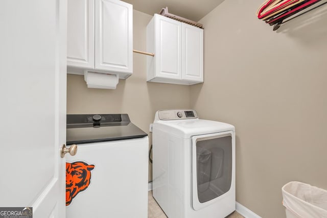 3982 Brockenhurst Dr, Buford, GA 30519 - washroom with washer and clothes dryer and cabinet space