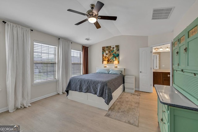 3982 Brockenhurst Dr, Buford, GA 30519 - bedroom featuring lofted ceiling, light wood-style flooring, baseboards, connected bathroom, and ceiling fan