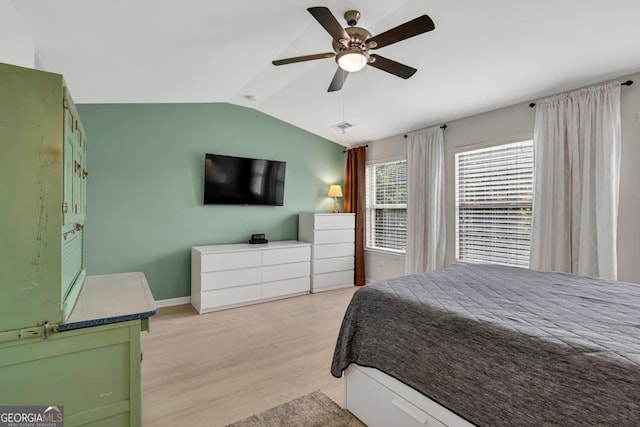 3982 Brockenhurst Dr, Buford, GA 30519 - bedroom with lofted ceiling, light wood finished floors, baseboards, and a ceiling fan