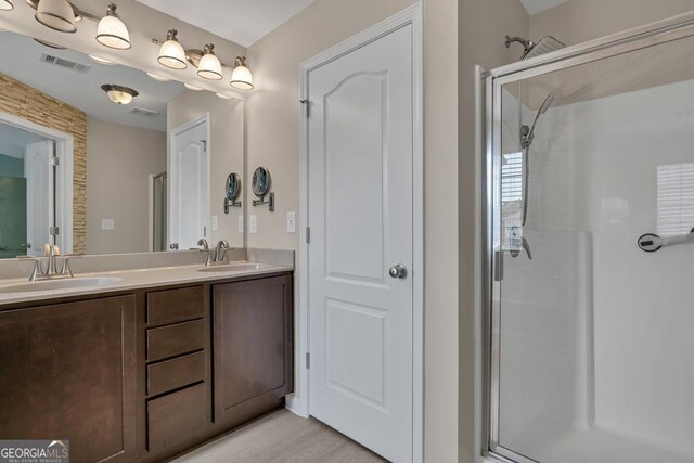 3982 Brockenhurst Dr, Buford, GA 30519 - bathroom with double vanity and an enclosed shower