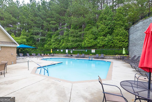 3982 Brockenhurst Dr, Buford, GA 30519 - community pool featuring a patio