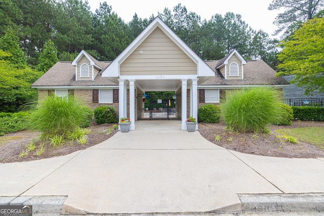 3982 Brockenhurst Dr, Buford, GA 30519 - view of building exterior with concrete driveway and a carport