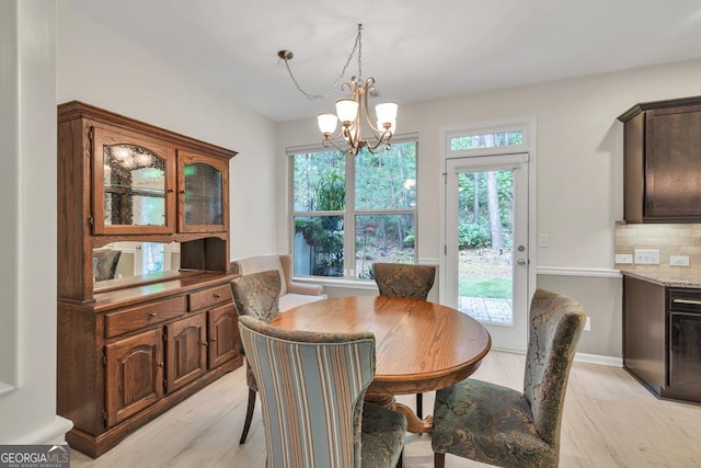 3982 Brockenhurst Dr, Buford, GA 30519 - dining room featuring a chandelier and light wood finished floors