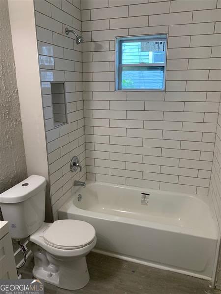 747 Harrold, Macon, GA 31201 - full bath featuring toilet, bathing tub / shower combination, and vanity