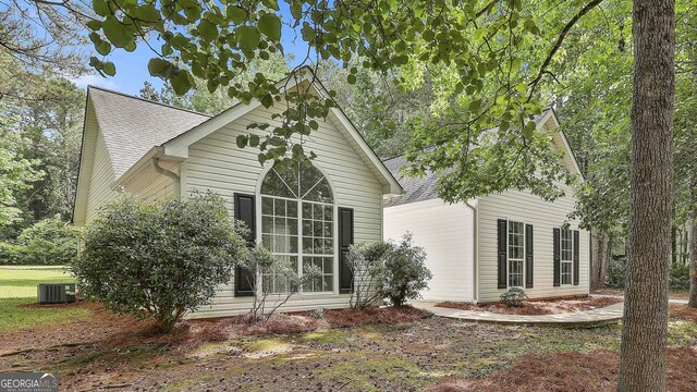 288 Winthrop Dr, Sharpsburg, GA 30277 - view of side of property featuring central air condition unit and roof with shingles