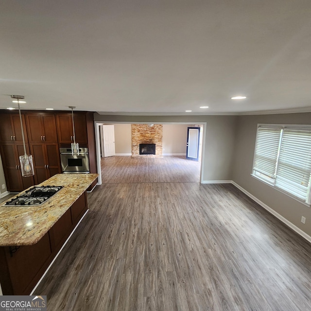 3140 Kipling Dr, Powder Springs, GA 30127 - unfurnished living room with a fireplace, dark wood-style floors, recessed lighting, and ornamental molding