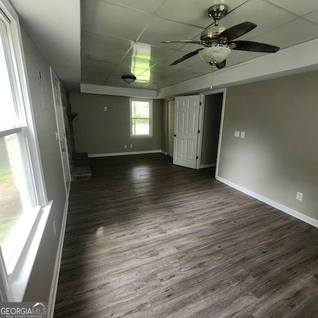 3140 Kipling Dr, Powder Springs, GA 30127 - spare room with dark wood-style flooring, a ceiling fan, and a paneled ceiling