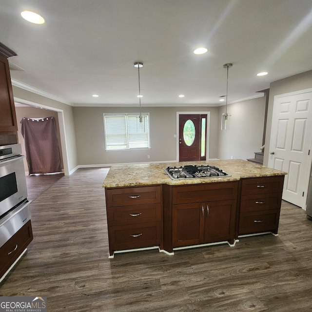 3140 Kipling Dr, Powder Springs, GA 30127 - kitchen with appliances with stainless steel finishes, crown molding, dark wood-style floors, decorative light fixtures, and light stone counters