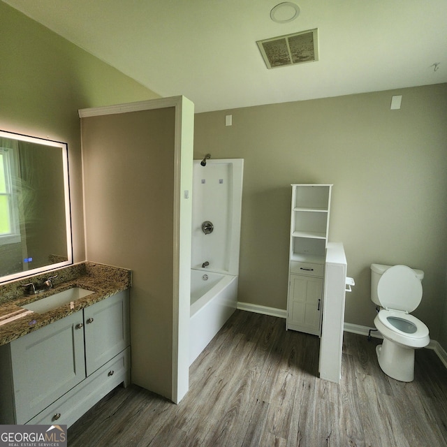 3140 Kipling Dr, Powder Springs, GA 30127 - bathroom with wood finished floors, vanity, and bathing tub / shower combination