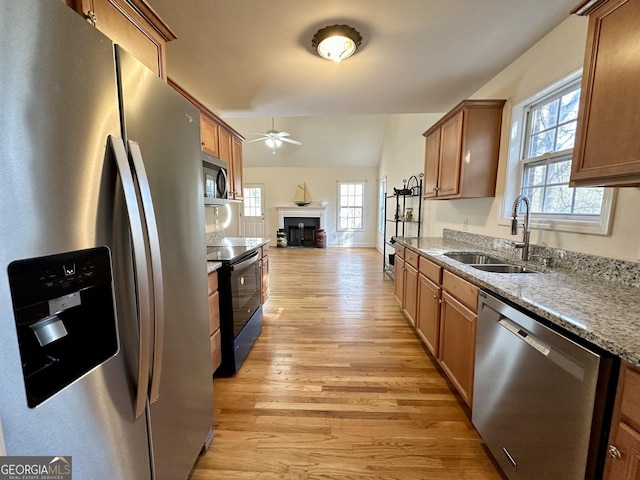 119 E Surry Ct, Athens, GA 30606 - kitchen with stainless steel appliances, a sink, ceiling fan, light wood-style floors, and open floor plan