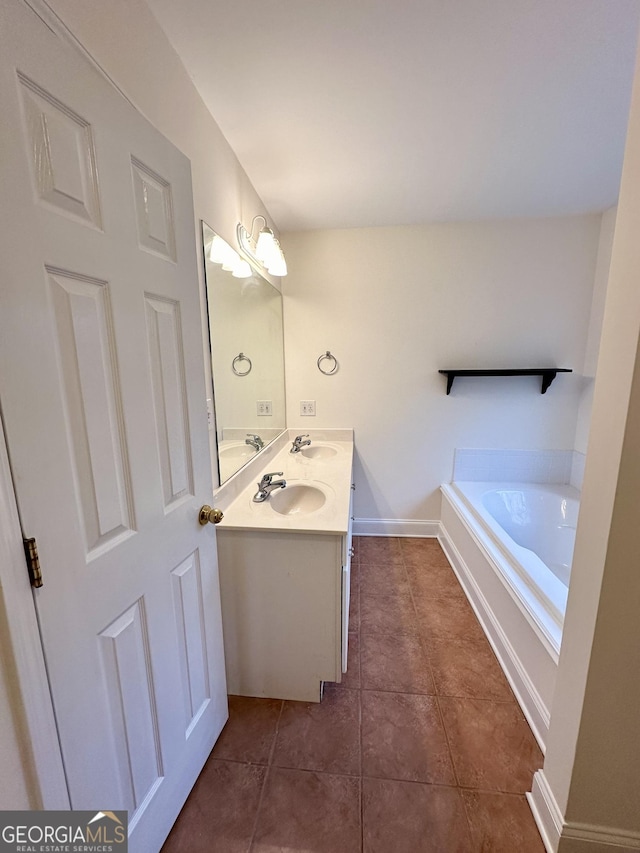 119 E Surry Ct, Athens, GA 30606 - full bathroom with tile patterned floors, double vanity, a garden tub, and baseboards