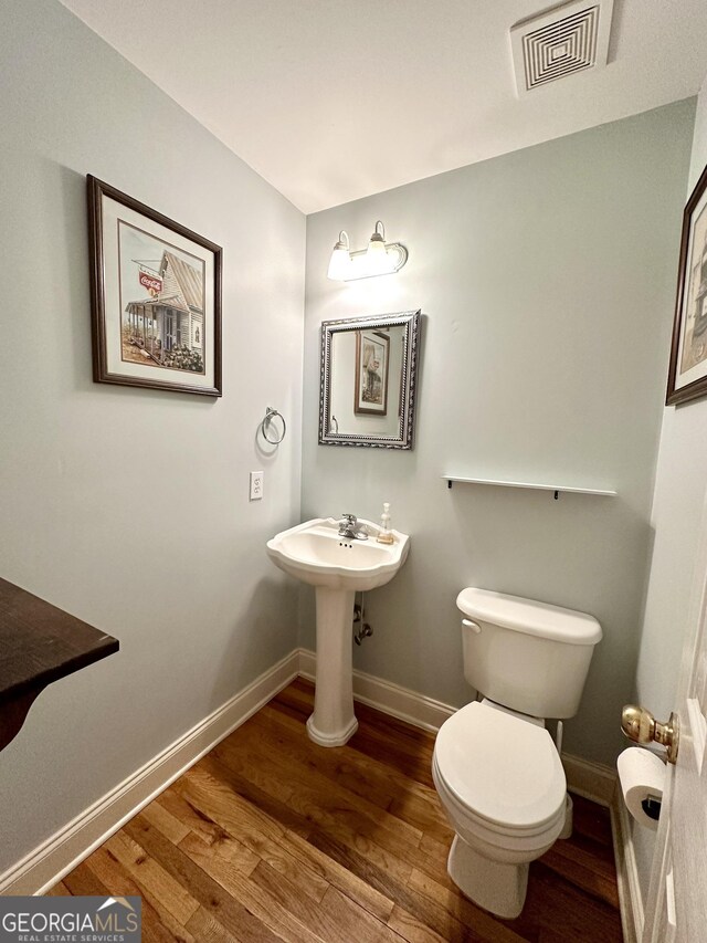 119 E Surry Ct, Athens, GA 30606 - bathroom with wood finished floors and baseboards