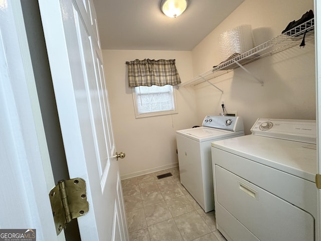 119 E Surry Ct, Athens, GA 30606 - laundry room with washer and clothes dryer, baseboards, and light tile patterned flooring