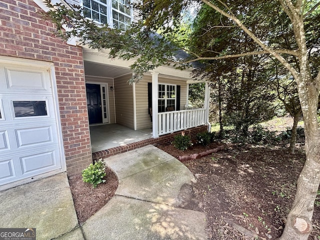 119 E Surry Ct, Athens, GA 30606 - doorway to property with covered porch and brick siding