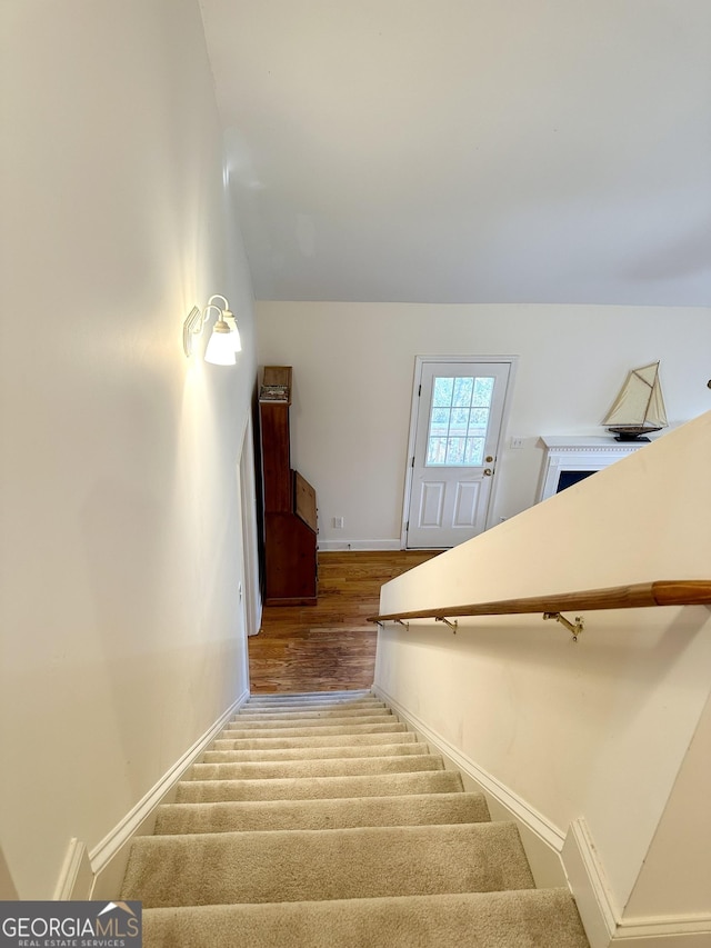 119 E Surry Ct, Athens, GA 30606 - stairs featuring baseboards, wood finished floors, and lofted ceiling