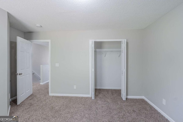 7250 Old Chapel, Atlanta, GA 30349 - unfurnished bedroom with carpet, a closet, and a textured ceiling