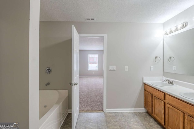 7250 Old Chapel, Atlanta, GA 30349 - full bath featuring a textured ceiling, double vanity, and a tub to relax in