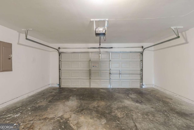 7250 Old Chapel, Atlanta, GA 30349 - garage featuring electric panel and a garage door opener