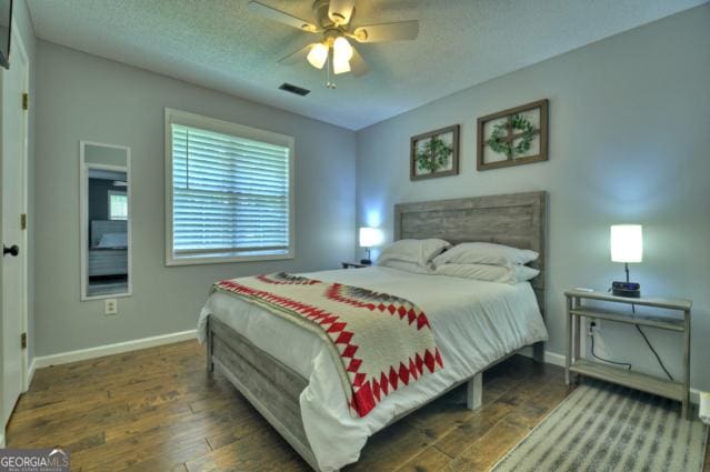 151 Padget Ln, Ellijay, GA 30540 - bedroom featuring wood-type flooring, baseboards, and a ceiling fan