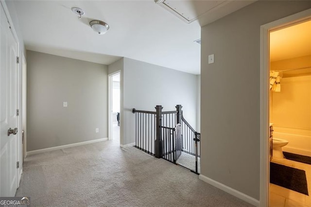 3589 Tamerton Trce, Buford, GA 30519 - hall with attic access, carpet, an upstairs landing, and baseboards