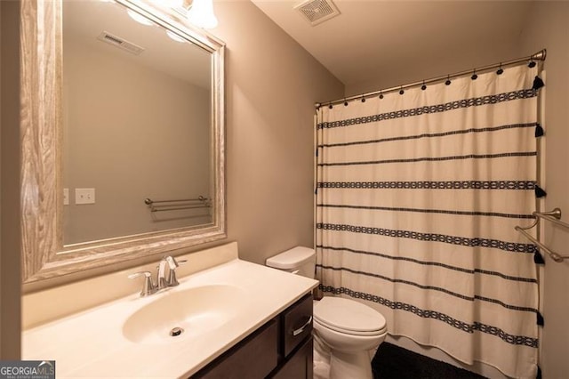 3589 Tamerton Trce, Buford, GA 30519 - bathroom featuring toilet, vanity, and a shower with curtain