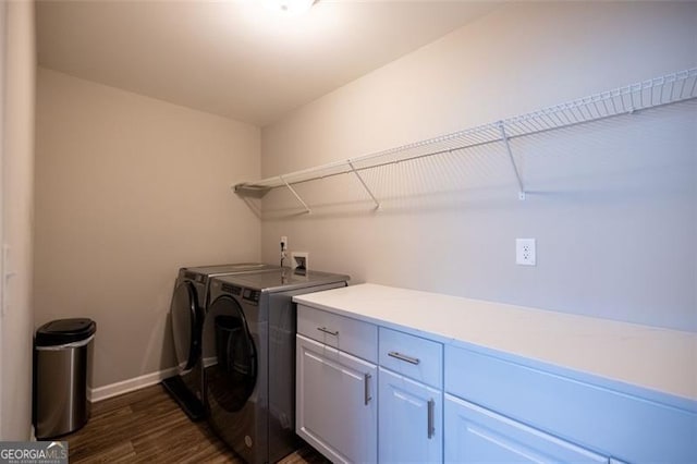 3589 Tamerton Trce, Buford, GA 30519 - laundry room featuring washer and dryer, dark wood-style floors, cabinet space, and baseboards