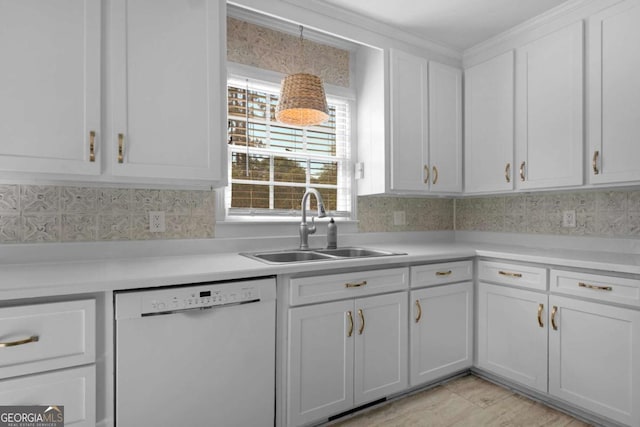 1504 Danora Dr, Waycross, GA 31501 - kitchen featuring dishwasher, decorative backsplash, light countertops, and white cabinets