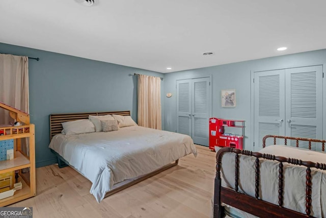 1504 Danora Dr, Waycross, GA 31501 - bedroom featuring light wood finished floors, two closets, and recessed lighting