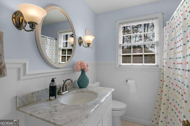 1504 Danora Dr, Waycross, GA 31501 - full bathroom with vanity, wainscoting, and a shower with curtain