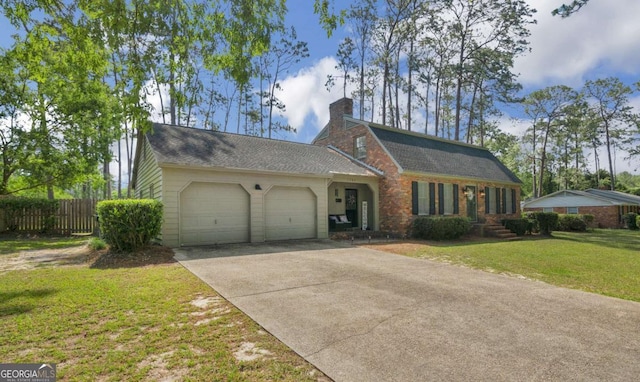 1504 Danora Dr, Waycross, GA 31501 - colonial inspired home with a garage, a chimney, and concrete driveway