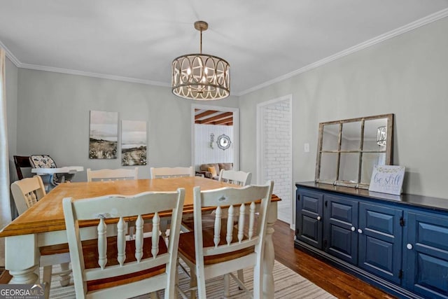 1504 Danora Dr, Waycross, GA 31501 - dining area with a chandelier, dark wood-type flooring, and ornamental molding