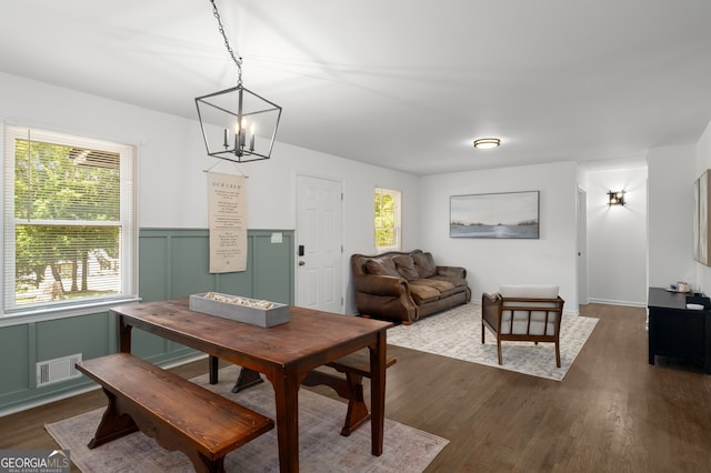 3142 Chamblee Gap Rd, Cumming, GA 30040 - dining area with a chandelier, dark wood-type flooring, plenty of natural light, and wainscoting
