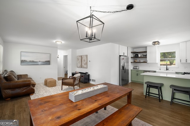 3142 Chamblee Gap Rd, Cumming, GA 30040 - dining area with dark wood finished floors and a chandelier