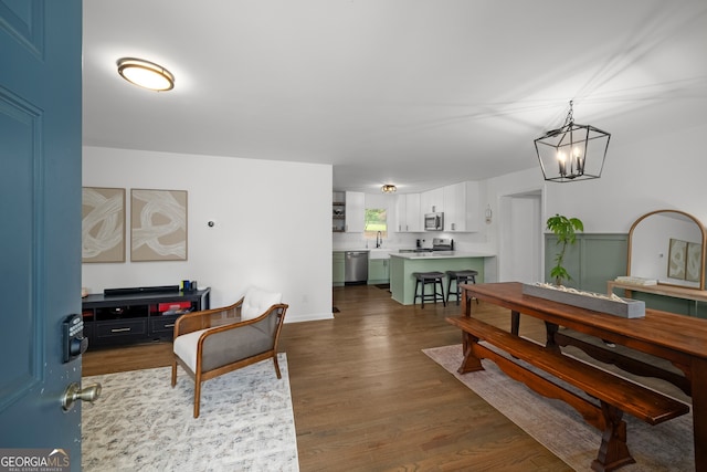 3142 Chamblee Gap Rd, Cumming, GA 30040 - living area featuring a chandelier and wood finished floors