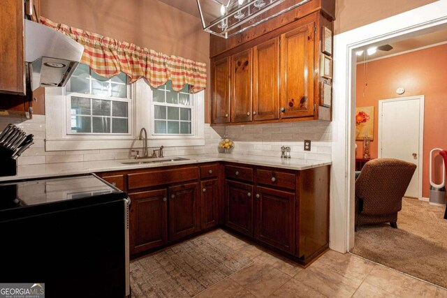 791 E Main St, Canton, GA 30114 - kitchen with ventilation hood, range with electric stovetop, light countertops, and backsplash