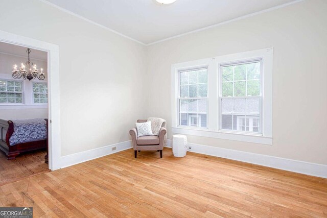 791 E Main St, Canton, GA 30114 - sitting room featuring ornamental molding, light wood-type flooring, and a chandelier