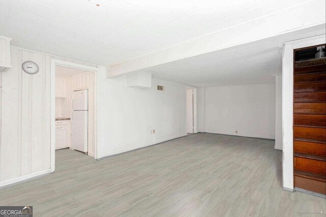 791 E Main St, Canton, GA 30114 - finished below grade area featuring freestanding refrigerator, light wood finished floors, and stairs