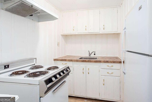 791 E Main St, Canton, GA 30114 - kitchen featuring white appliances, extractor fan, and white cabinets