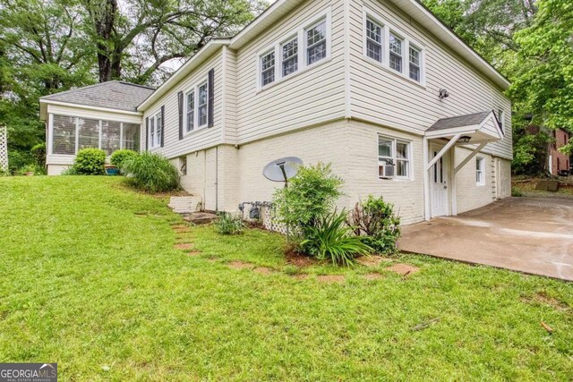 791 E Main St, Canton, GA 30114 - view of side of property with brick siding, a lawn, a patio, and cooling unit