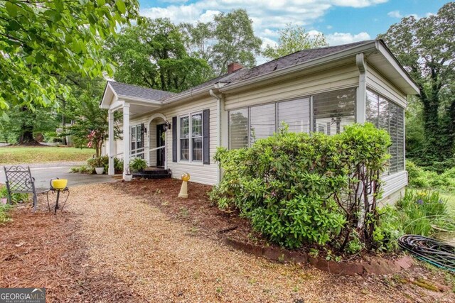 791 E Main St, Canton, GA 30114 - view of side of property featuring a chimney