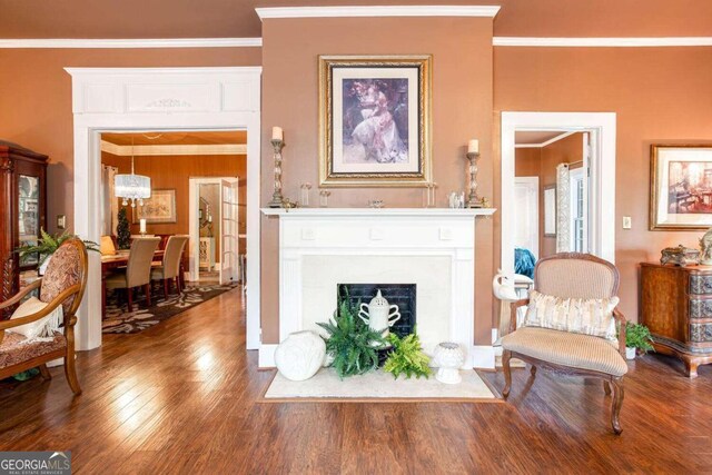 791 E Main St, Canton, GA 30114 - living area featuring ornamental molding, wood finished floors, and a fireplace with flush hearth