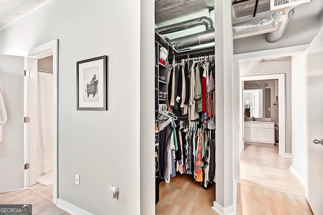 800 Peachtree St NE Unit 1319, Atlanta, GA 30308 - walk in closet featuring wood finished floors