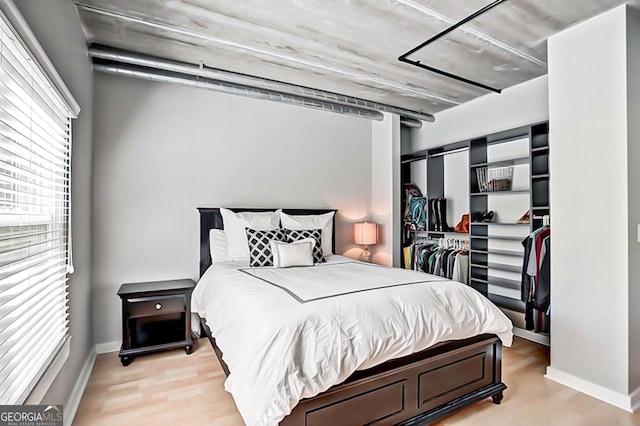 800 Peachtree St NE Unit 1319, Atlanta, GA 30308 - bedroom featuring light wood-style flooring and a closet