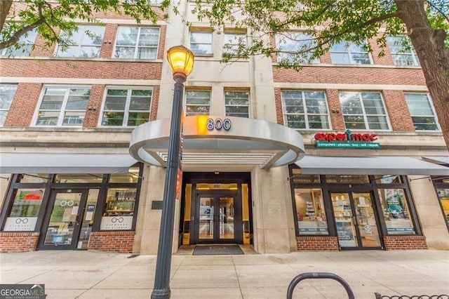 800 Peachtree St NE Unit 1319, Atlanta, GA 30308 - view of exterior entry featuring french doors and brick siding
