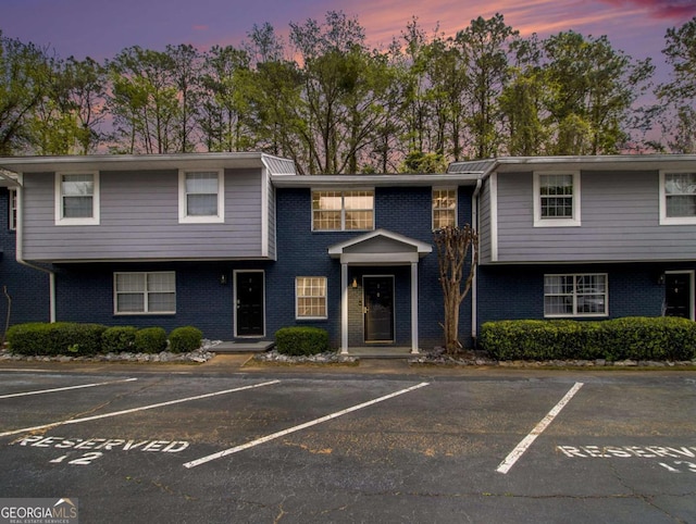 3149 Buford Hwy NE Unit 3, Brookhaven, GA 30329 - townhome / multi-family property with brick siding and uncovered parking
