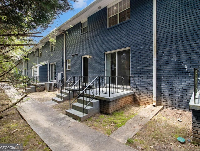 3149 Buford Hwy NE Unit 3, Brookhaven, GA 30329 - rear view of property with cooling unit and brick siding